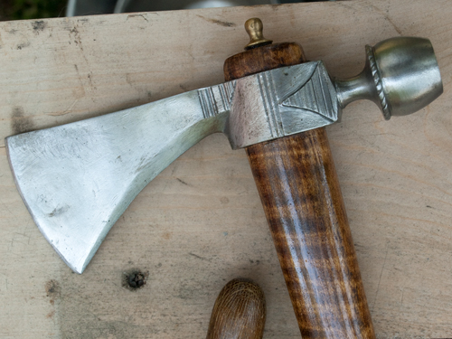 The head of a tomahawk with an ax and a pipe bowl